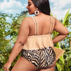 Black and brown zebra print swim suit. New with tag. Sticker tags